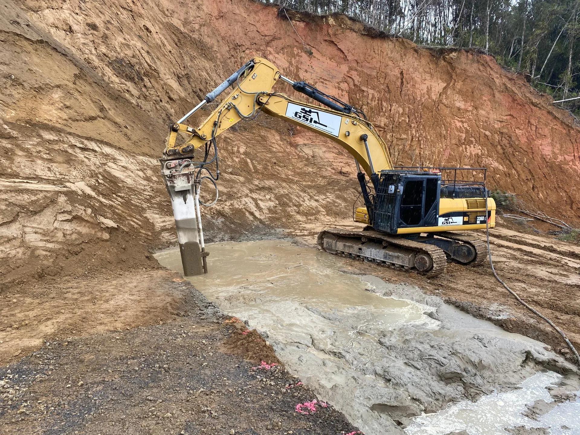 NZ roadside embankment slope prepared for stabilisation with geotextile membrane and soil nail layout