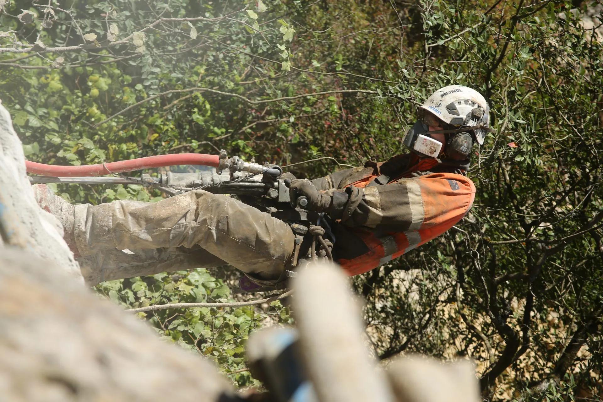 GSI crew operating drilling equipment on the Epitaph Haast Pass rockfall remediation project